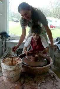 Elijah making a pot on the wheel